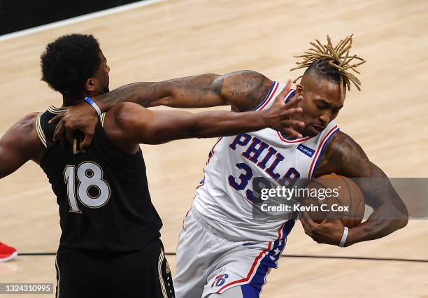 Dwight Howard of the Philadelphia 76ers grabs a rebound against Solomon Hill of the Atlanta Hawks during the second half of game 6 of the Eastern...