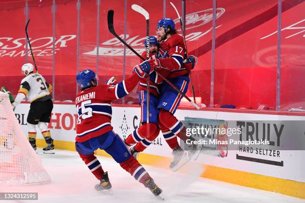 Josh Anderson of the Montreal Canadiens is congratulated by Paul Byron and Jesperi Kotkaniemi after scoring the game-winning goal against the Vegas...