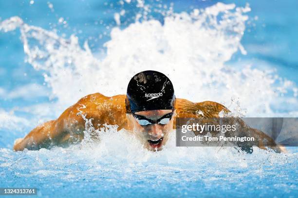 Caeleb Dressel of the United States competes in a semifinal heat for the Men's 100m butterfly during Day Six of the 2021 U.S. Olympic Team Swimming...