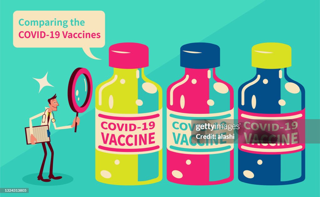 Un medico che controlla e confronta diversi vaccini COVID-19 con una lente d'ingrandimento