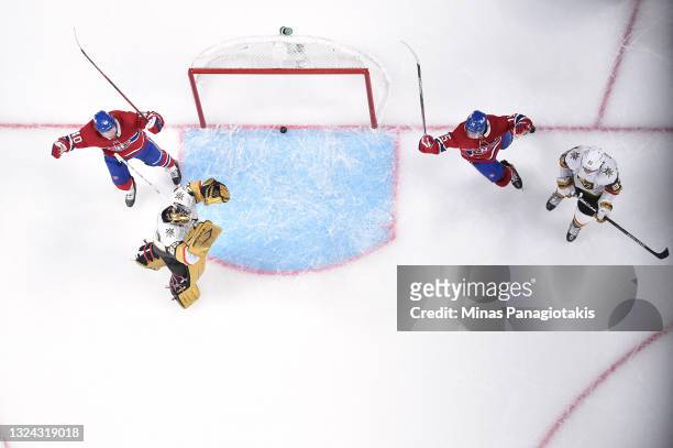 Jesperi Kotkaniemi and Joel Armia of the Montreal Canadiens celebrate a goal by teammate Josh Anderson , past Marc-Andre Fleury of the Vegas Golden...