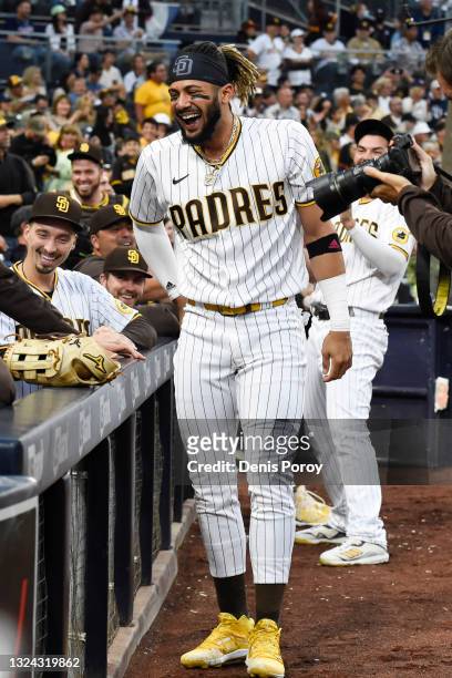 Fernando Tatis Jr. #23 of the San Diego Padres jokes around during the second inning of a baseball game against the Cincinnati Reds at Petco Park on...