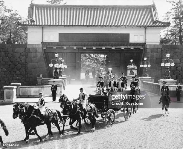 Crown Prince of Japan, Akihito and Michiko Shoda driving through Tokyo after their wedding at Tokyo Imperial Palace, 10th April 1959.