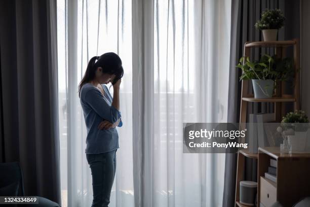 asian depression sad young woman - photos of suicide victims stock pictures, royalty-free photos & images
