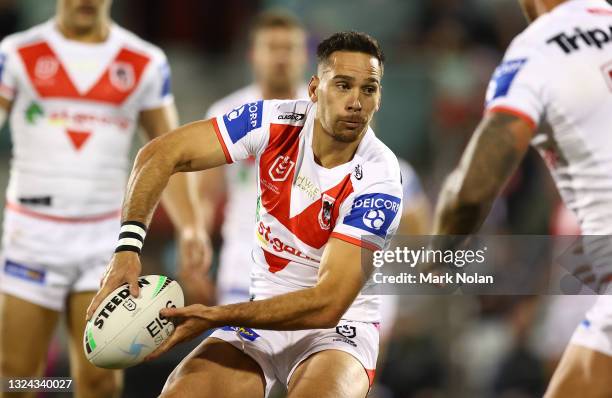 Corey Norman of the Dragons passes during the round 15 NRL match between the St George Illawarra Dragons and the Canberra Raiders at WIN Stadium, on...