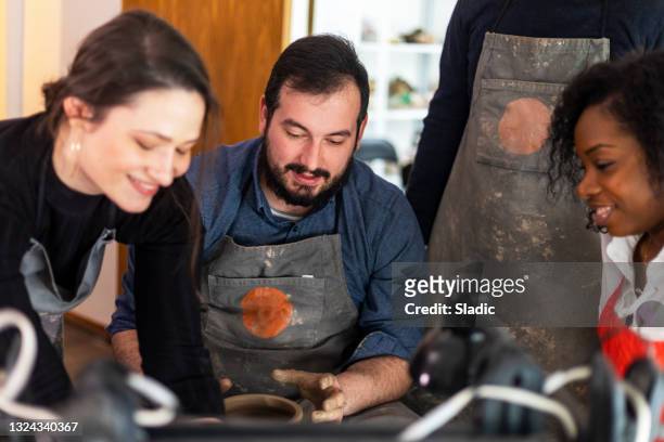 pottery workshop - molding a shape stockfoto's en -beelden