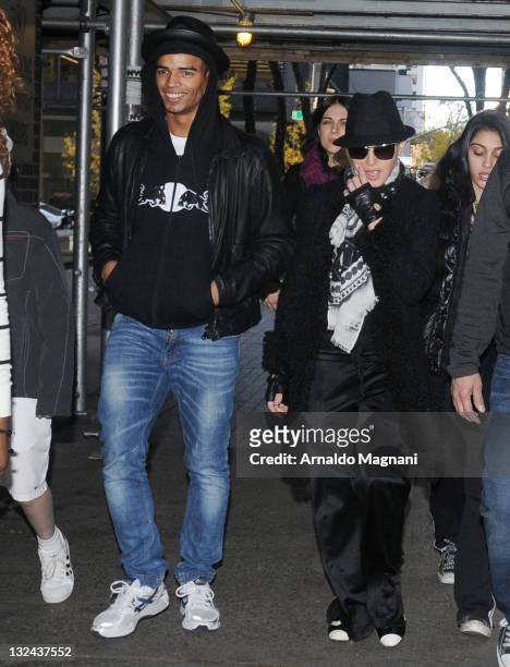 Madonna and her boyfriend Brahim Zaibat arrive for Kabbalah service in New York City on November 12, 2011 in New York City.