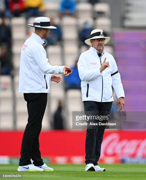 Umpire Richard Illingworth shows the soft signal as out for the wicket of Virat Kohli of india which is later overturned alongside Michael Gough...