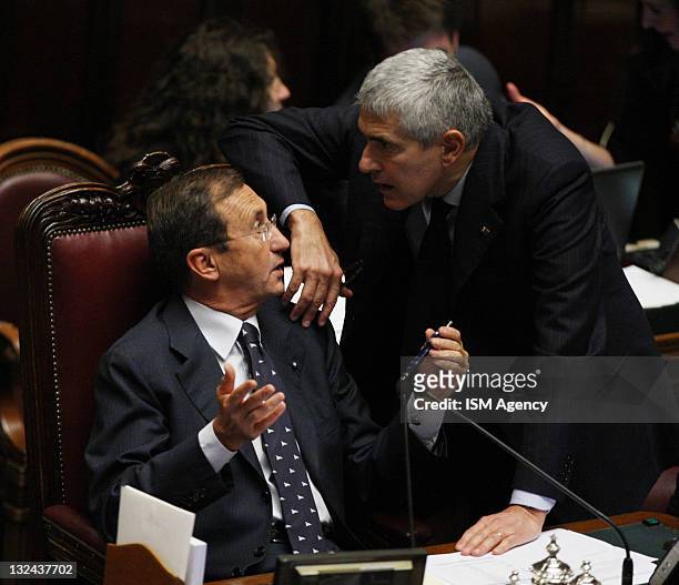 Italian Parlament Speaker Gianfranco Fini speaks with Union of Center Party Pier Ferdinando Casini during a vote on 2012 budget law on November 12,...