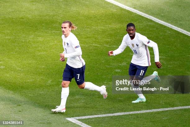 Antoine Griezmann of France celebrates with Ousmane Dembele after scoring their side's first goal during the UEFA Euro 2020 Championship Group F...