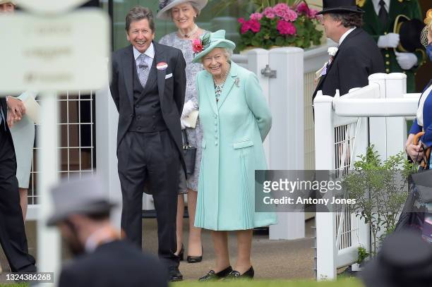 Queen Elizabeth II and John Warren watch as horses are led into the parade ring during Royal Ascot 2021 at Ascot Racecourse on June 19, 2021 in...