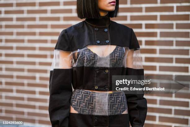 Guest wears Fendi underwear, a black denim and transparent tulle striped short dress, outside Berluti, during Paris Fashion Week - Menswear F/W...