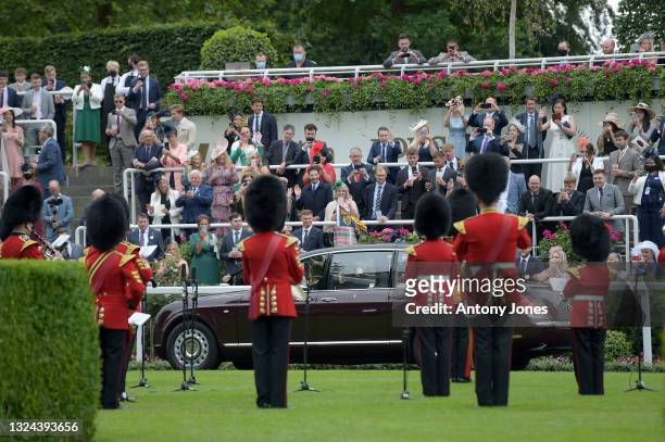 Crowds of racegoers watch as Queen Elizabeth II arrives from the winner's circle during Royal Ascot 2021 at Ascot Racecourse on June 19, 2021 in...