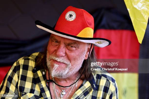 Football fans react during the UEFA EURO 2020 match between Germany and Portugal at garden plot Hohe Birk on June 19, 2021 in Essen, Germany. Due to...