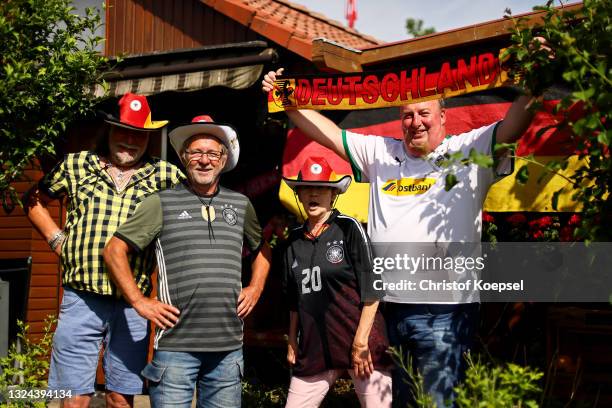 Football fans react during the UEFA EURO 2020 match between Germany and Portugal at garden plot Hohe Birk on June 19, 2021 in Essen, Germany. Due to...