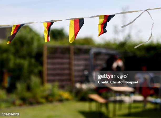 German flags at a garden plot during the UEFA EURO 2020 match between Germany and Portugal at garden plot Hohe Birk on June 19, 2021 in Essen,...