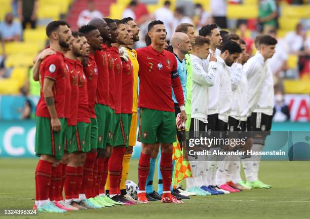 Cristiano Ronaldo of Portugal sings the national anthem with team mates prior to the UEFA Euro 2020 Championship Group F match between Portugal and...