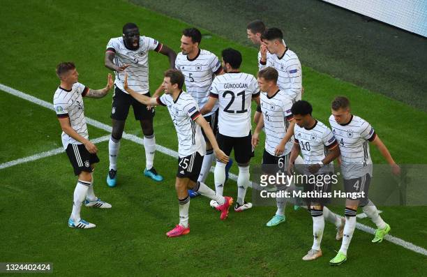 Players of Germany celebrate their side's second goal, an own goal by Raphael Guerreiro of Portugal during the UEFA Euro 2020 Championship Group F...