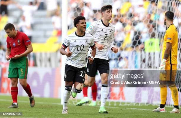 Serge Gnabry and Kai Havertz of Germany celebrate their side's second goal, an own goal by Raphael Guerreiro of Portugal during the UEFA Euro 2020...