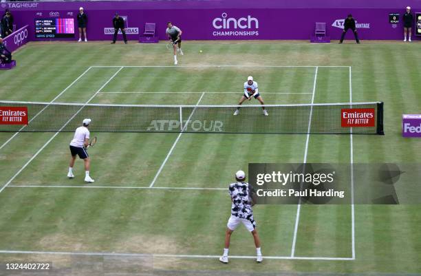 Cameron Norrie of Great Britain, playing partner of Alex de Minaur of Australia serves during his Semi-final match against Reilly Opelka of USA and...