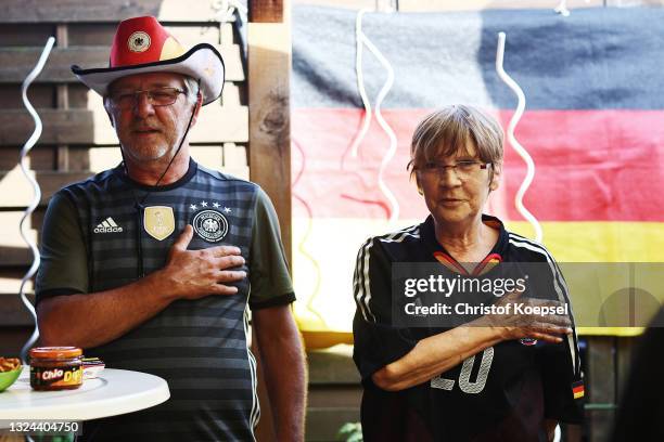 Fans reacting on the UEFA EURO 2020 match between Germany and Portugal at garden plot Hohe Birk on June 19, 2021 in Essen, Germany. Due to Covid-19...