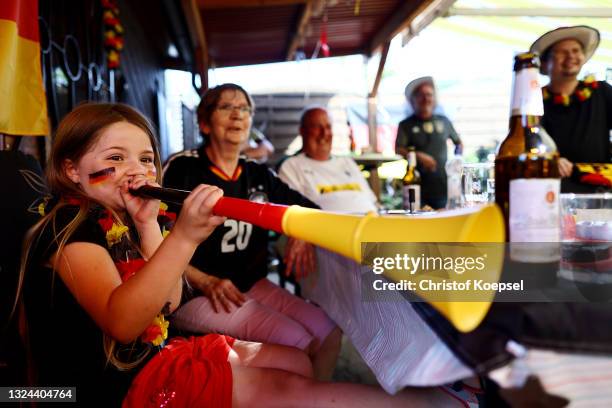 Fans reacting on the UEFA EURO 2020 match between Germany and Portugal at garden plot Hohe Birk on June 19, 2021 in Essen, Germany. Due to Covid-19...