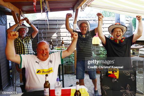 Fans reacting on the UEFA EURO 2020 match between Germany and Portugal at garden plot Hohe Birk on June 19, 2021 in Essen, Germany. Due to Covid-19...