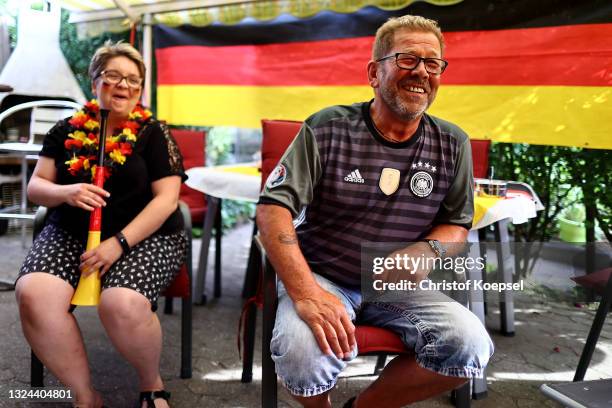 Fans reacting on the UEFA EURO 2020 match between Germany and Portugal at garden plot Hohe Birk on June 19, 2021 in Essen, Germany. Due to Covid-19...