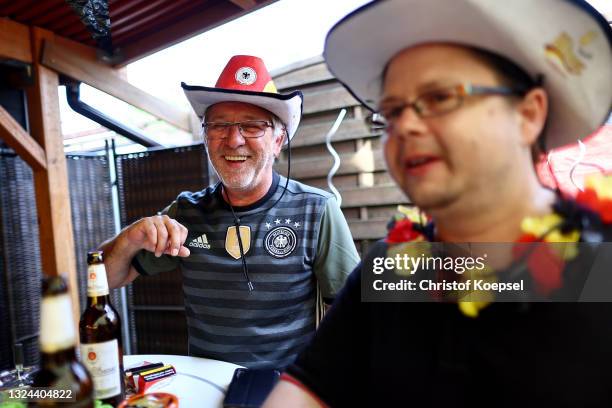 Fans reacting on the UEFA EURO 2020 match between Germany and Portugal at garden plot Hohe Birk on June 19, 2021 in Essen, Germany. Due to Covid-19...