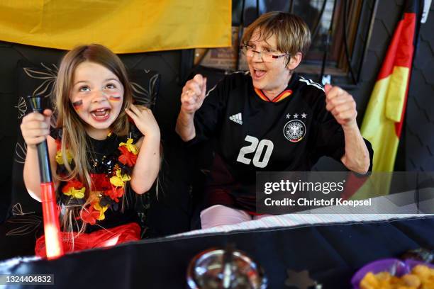 Fans reacting on the UEFA EURO 2020 match between Germany and Portugal at garden plot Hohe Birk on June 19, 2021 in Essen, Germany. Due to Covid-19...