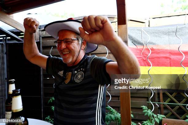 Fan react on the UEFA EURO 2020 match between Germany and Portugal at garden plot Hohe Birk on June 19, 2021 in Essen, Germany. Due to Covid-19...