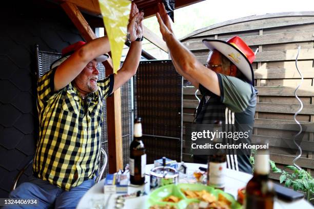 Fans reacting on the UEFA EURO 2020 match between Germany and Portugal at garden plot Hohe Birk on June 19, 2021 in Essen, Germany. Due to Covid-19...