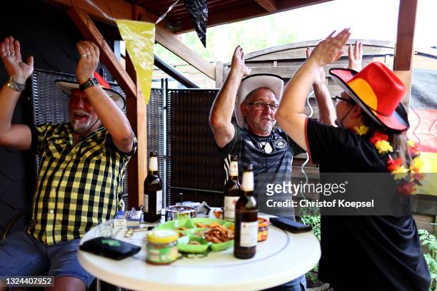 Fans reacting on the UEFA EURO 2020 match between Germany and Portugal at garden plot Hohe Birk on June 19, 2021 in Essen, Germany. Due to Covid-19...