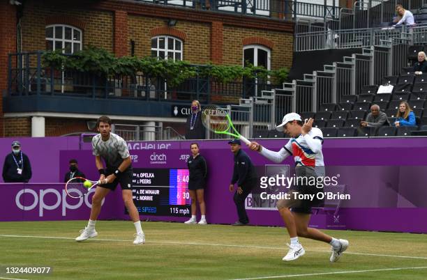 Alex de Minaur of Australia, playing partner of Cameron Norrie of Great Britain plays a forehand during his Semi-final match against Reilly Opelka of...