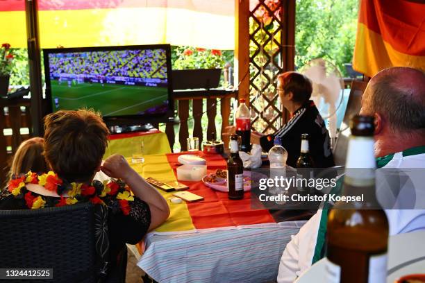 Fans reacting on the UEFA EURO 2020 match between Germany and Portugal at garden plot Hohe Birk on June 19, 2021 in Essen, Germany. Due to Covid-19...