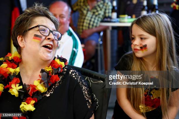 Fans reacting on the UEFA EURO 2020 match between Germany and Portugal at garden plot Hohe Birk on June 19, 2021 in Essen, Germany. Due to Covid-19...