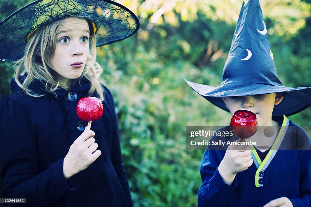 Two children dressed up as witches