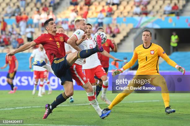 Gerard Moreno of Spain attempts to control the ball whilst under pressure from Tymoteusz Puchacz of Poland during the UEFA Euro 2020 Championship...