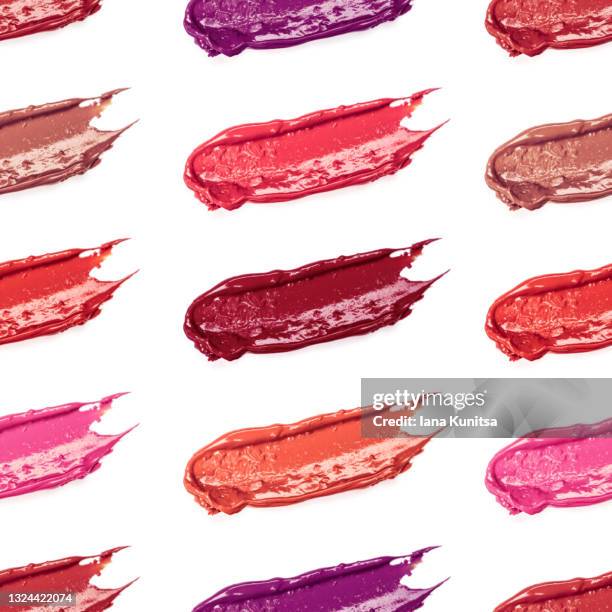 red, pink, burgundy lipstick smears on white background. isolated. lip gloss samples are smudged. beauty cosmetic banner. seamless pattern. makeup and skin care products. cosmetology. - damp lips stock-fotos und bilder