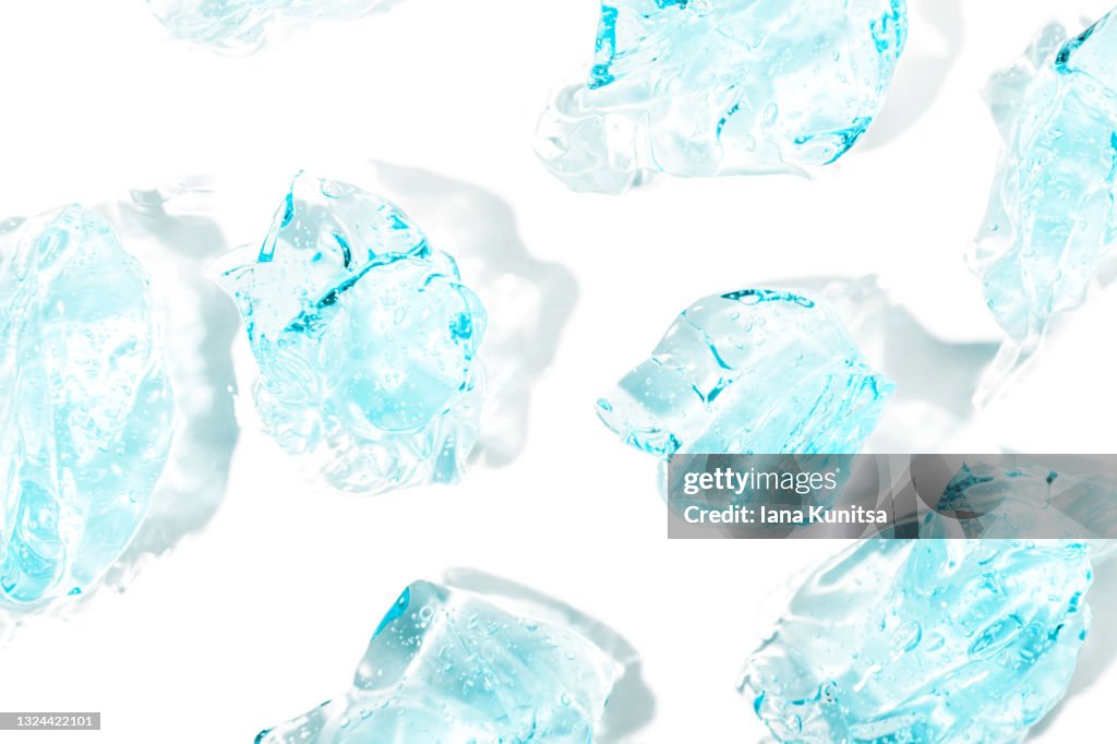 Transparent blue smudged of liquid moisture serum for face on white background isolated. Hydrating hyaluronic acid. Hair gel with bubbles. Cosmetic products for makeup and skin care. Cosmetology.