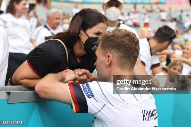 Joshua Kimmich of Germany interacts with Girlfriend, Lina Meyer following the UEFA Euro 2020 Championship Group F match between Portugal and Germany...