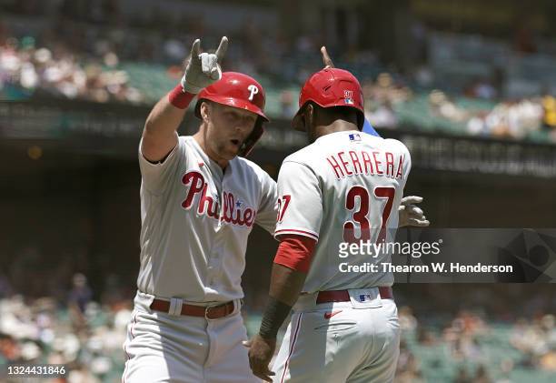 Rhys Hoskins and Odubel Herrera of the Philadelphia Phillies celebrates after Hoskins hit a two-run home run against the San Francisco Giants in the...