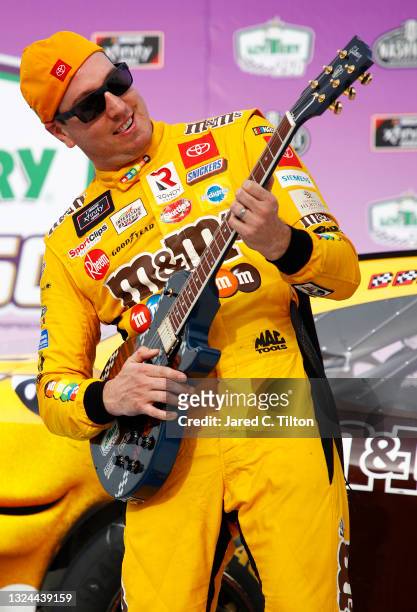 Kyle Busch, driver of the M&M's Toyota, celebrates in victory lane after winning the NASCAR Xfinity Series Tennessee Lottery 250 at Nashville...