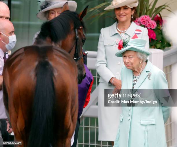 Queen Elizabeth II and her horse 'Reach for the Moon' on which Jockey Frankie Dettori finished in second place in The Chesham Stakes on day 5 of...