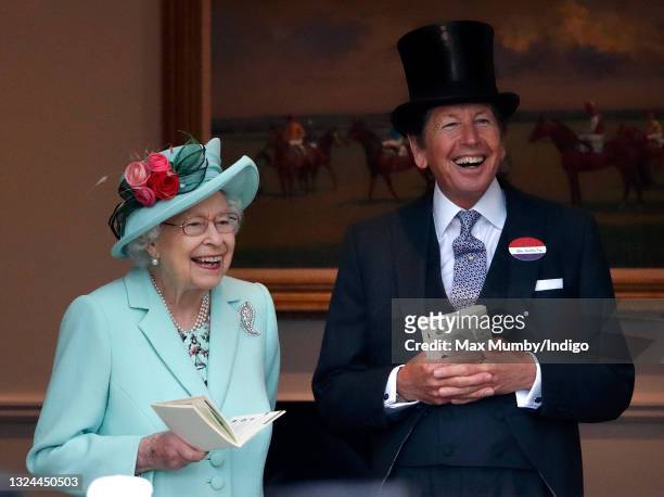 Queen Elizabeth II accompanied by her racing manager John Warren, attends day 5 of Royal Ascot at Ascot Racecourse on June 19, 2021 in Ascot, England.