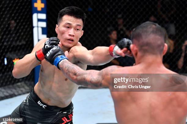 The Korean Zombie' Chan Sung Jung of South Korea punches Dan Ige in a featherweight bout during the UFC Fight Night event at UFC APEX on June 19,...