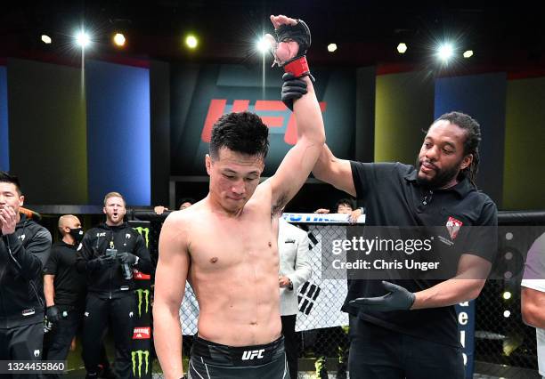 The Korean Zombie' Chan Sung Jung of South Korea reacts after his victory over Dan Ige in a featherweight bout during the UFC Fight Night event at...