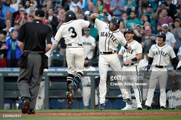 Crawford of the Seattle Mariners celebrates with teammates after hitting a grand slam during the game against the Tampa Bay Rays at T-Mobile Park on...