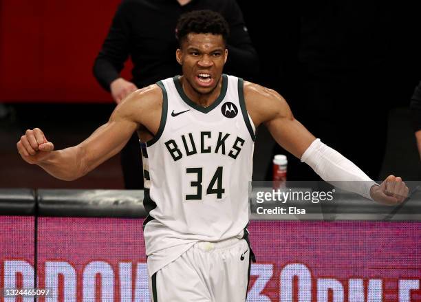 Giannis Antetokounmpo of the Milwaukee Bucks celebrates the win of game seven of the Eastern Conference second round at Barclays Center on June 19,...