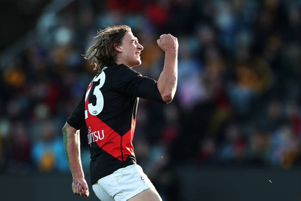 Harrison Jones of the Bombers celebrates a goal during the round 14 AFL match between the Hawthorn Hawks and the Essendon Bombers at University of...